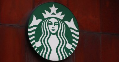 The logo of the American coffee company Starbucks on a wall outside a coffee shop in Mexico City, Mexico, July 24, 2024. (Reuters Photo)