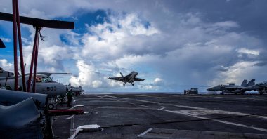 An F/A-18F Super Hornet, assigned to Strike Fighter Squadron (VFA) 41, prepares to make an arrested landing on the flight deck of the U.S. Navy Nimitz-class aircraft carrier USS Abraham Lincoln in the Pacific Ocean, Aug. 10, 2024. (U.S. Navy/Mass Communication Specialist Seaman Apprentice Daniel Kimmelman/Handout via Reuters)