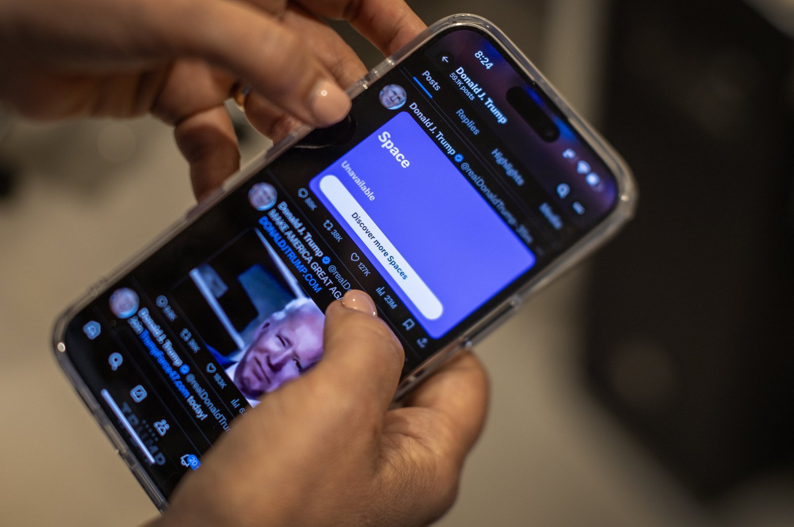 A person tries to access the social media platform &#039;X&#039; to listen to U.S. Former President Donald J. Trump&#039;s interview with Elon Musk, Miami, Florida, U.S., Aug. 12, 2024. (EPA Photo)