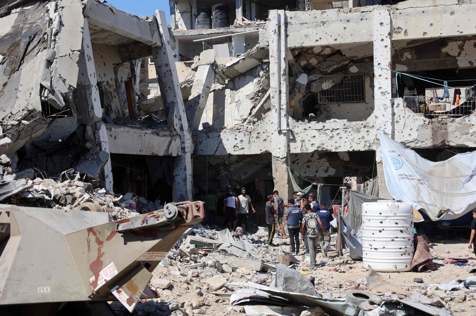 People check the damage at the al-Zahra school used as a refuge by displaced Palestinians following an Israeli strike, Shujaiya neighborhood, Gaza City, Palestine, Aug. 8, 2024. (AFP Photo)