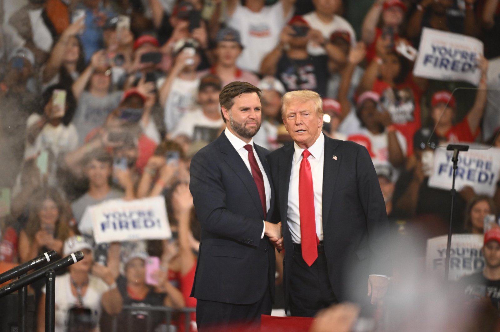 Republican presidential candidate Donald J. Trump (R) and Republican vice presidential candidate Senator JD Vance (L) of Ohio appear on stage during a campaign rally at the Georgia State Convocation Center, Atlanta, Georgia, U.S., Aug. 3, 2024. (EPA Photo)