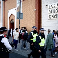 Police officers stand guard outside the East London Mosque after Friday prayers in Tower Hamlets in London, Aug. 9, 2024. (AFP Photo)