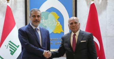 Iraqi Foreign Minister Fuad Hussein (R) shakes hands with visiting Foreign Minister Hakan Fidan (L), Baghdad, Iraq, March 14, 2024. (AP Photo)