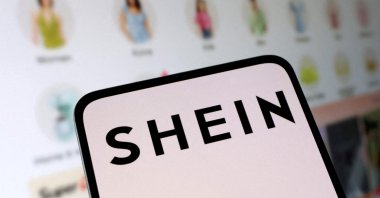 The Shein logo and its web shop are seen in this illustration taken May 16, 2024. (Reuters Photo)
