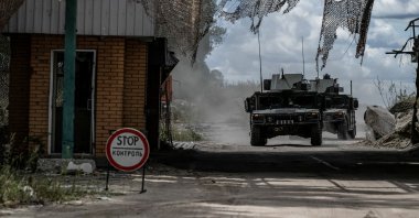 Ukrainian servicemen ride military vehicles from a crossing point at the border with Russia, in Sumy region, Ukraine, Aug. 13, 2024. (Reuters Photo)
