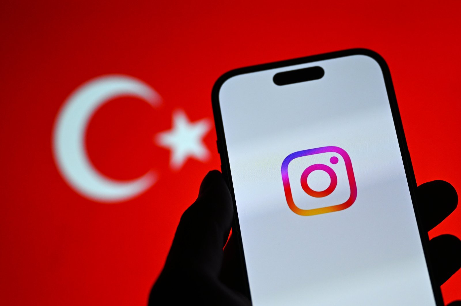 The Instagram logo is seen with a backdrop of the Turkish flag in this illustration taken on Aug. 10, 2024. (AA Photo)