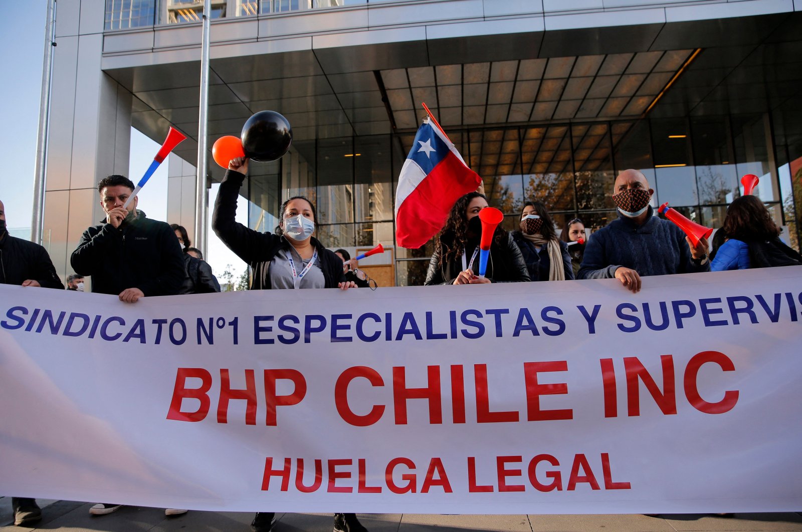 Workers of the Escondida copper mine protest during a strike outside BHP Billiton&#039;s offices in Santiago, Chile, May 27, 2021. (AFP Photo)