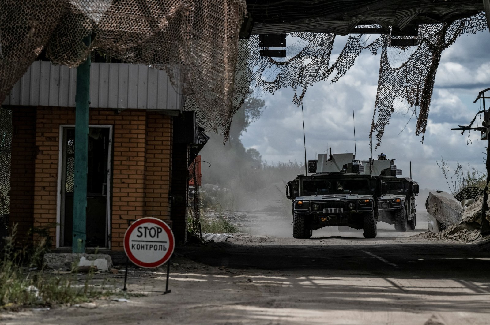 Ukrainian servicemen ride military vehicles from a crossing point at the border with Russia, in Sumy region, Ukraine, Aug. 13, 2024. (Reuters Photo)