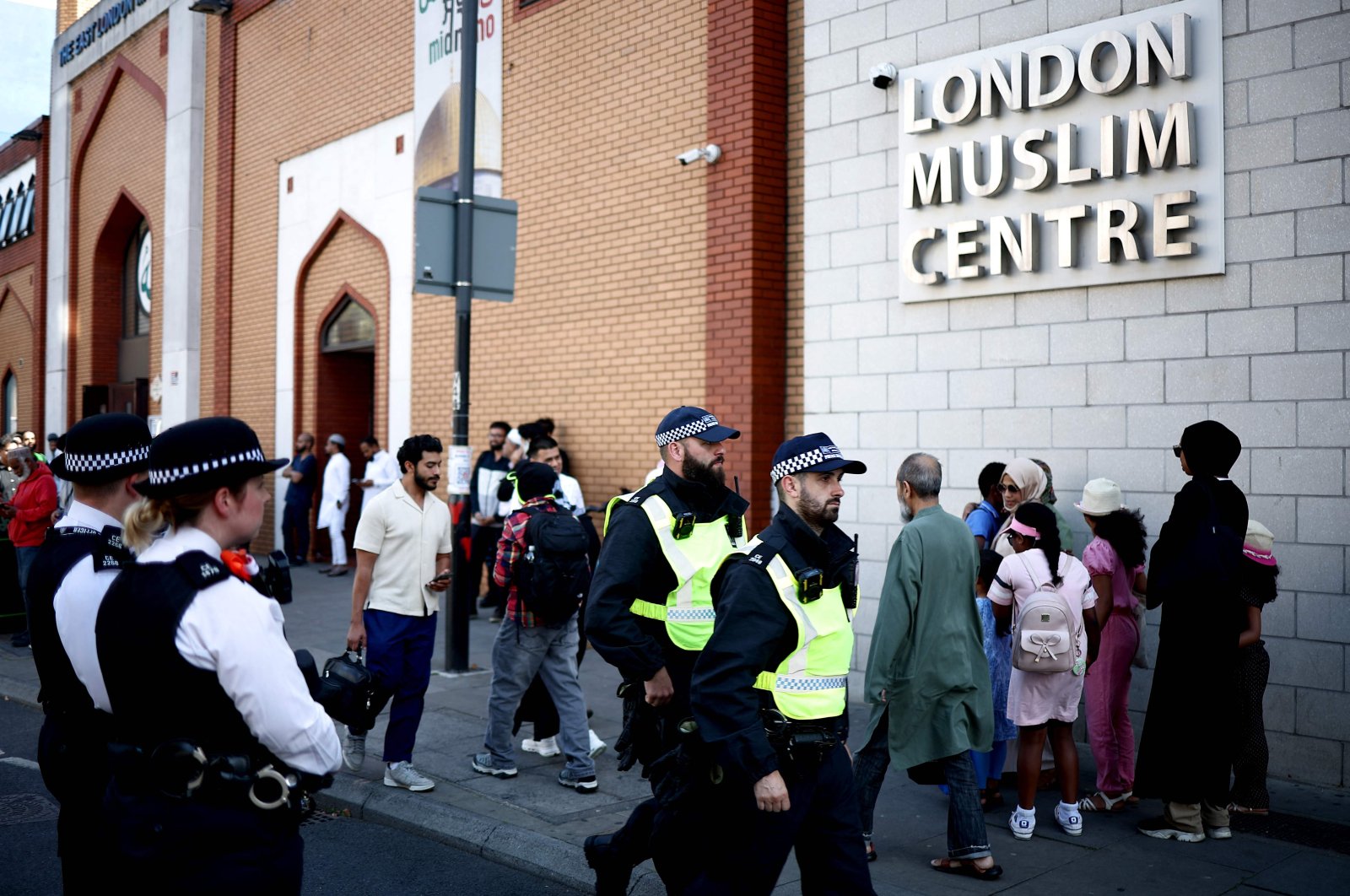 Police officers stand guard outside the East London Mosque after Friday prayers in Tower Hamlets in London, Aug. 9, 2024. (AFP Photo)