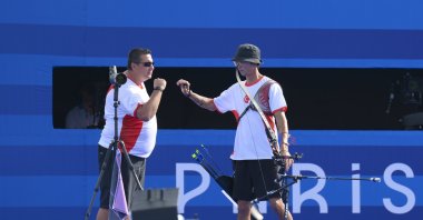 Türkiye&#039;s archery national team coach Yusuf Göktuğ Ergin (L) celebrates with Mete Gazoz at the 2024 Paris Olympics, Paris, France, July 30, 2024. (AA Photo)