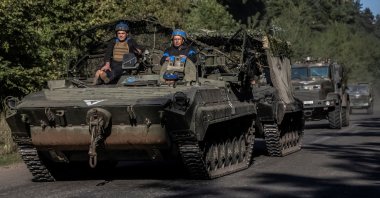 Ukrainian servicemen ride an armored personnel carrier amid Russia's attack on Ukraine, near the Russian border in Sumy region, Ukraine, Aug. 14, 2024. (Reuters Photo)