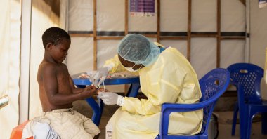 A laboratory nurse takes a sample from a child declared a suspected case of mpox at the treatment center in Munigi, Democratic Republic of the Congo, July 19, 2024. (Reuters Photo)