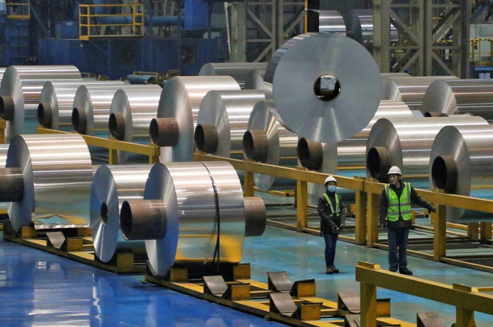 Employees work at a production line of aluminum rolls at a factory in Zouping, Shandong Province, China, Nov. 23, 2019. (Reuters Photo)