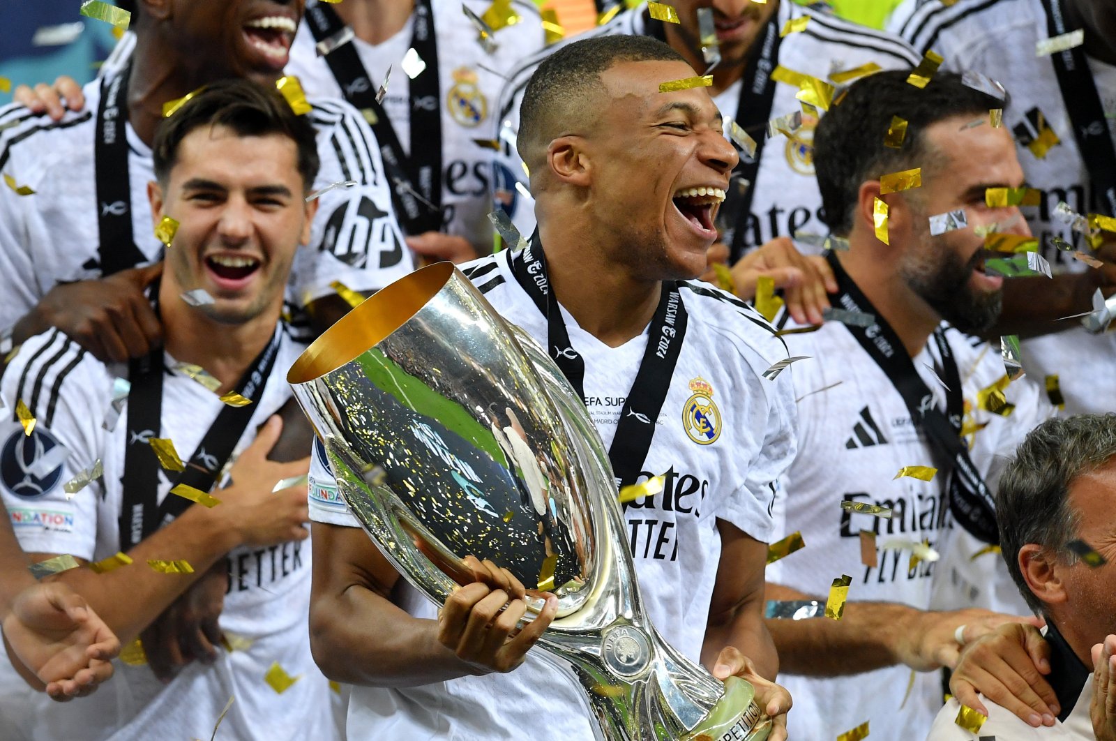 Real Madrid&#039;s Kylian Mbappe celebrates with the trophy after winning the Super Cup against Atalanta at National Stadium, Warsaw, Poland, Aug. 14, 2024. (Reuters Photo) 