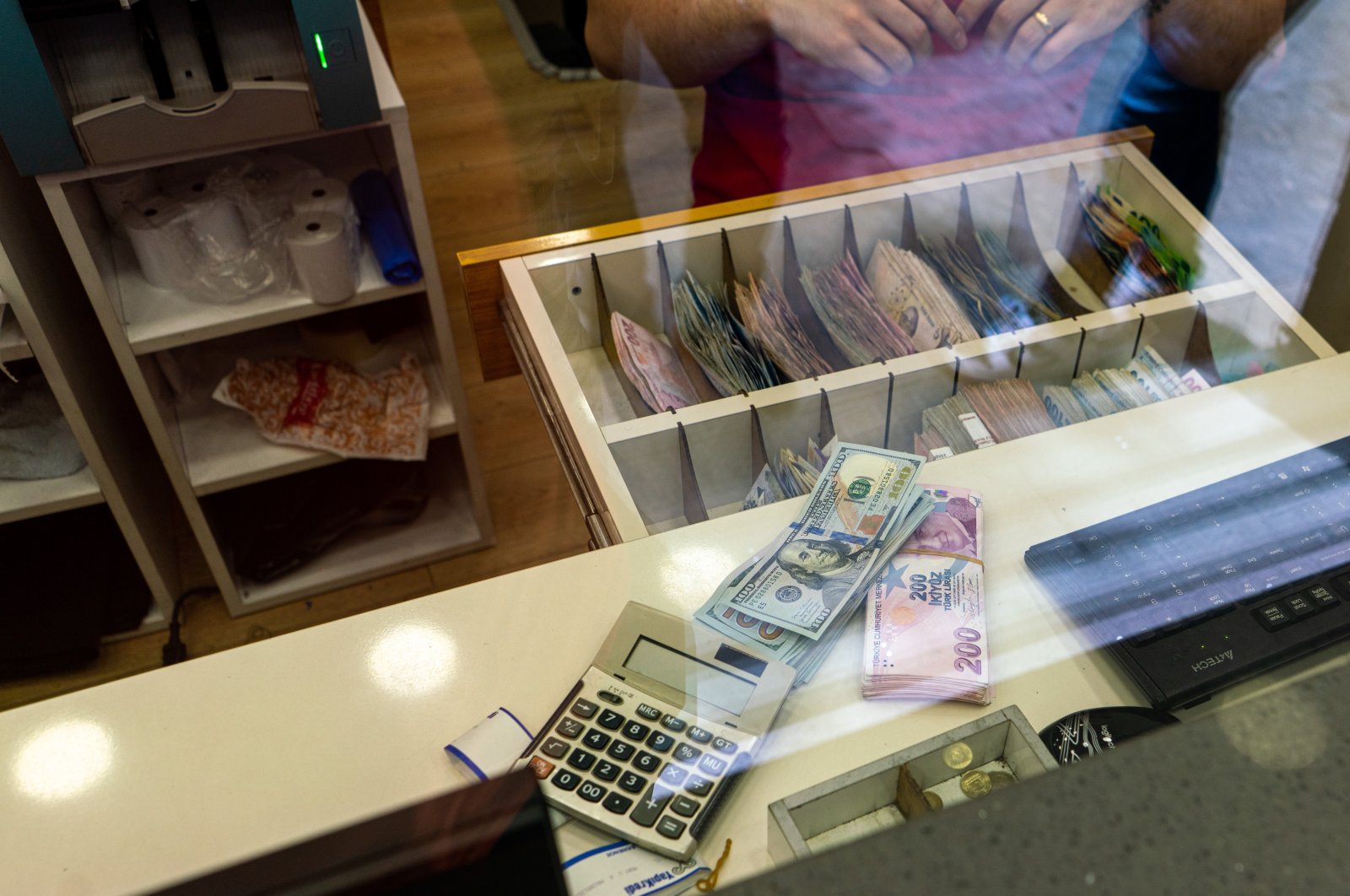 Dollar and Turkish lira banknotes are seen displayed at the currency exchange office, Istanbul, Türkiye, June 8, 2023. (Reuters Photo)