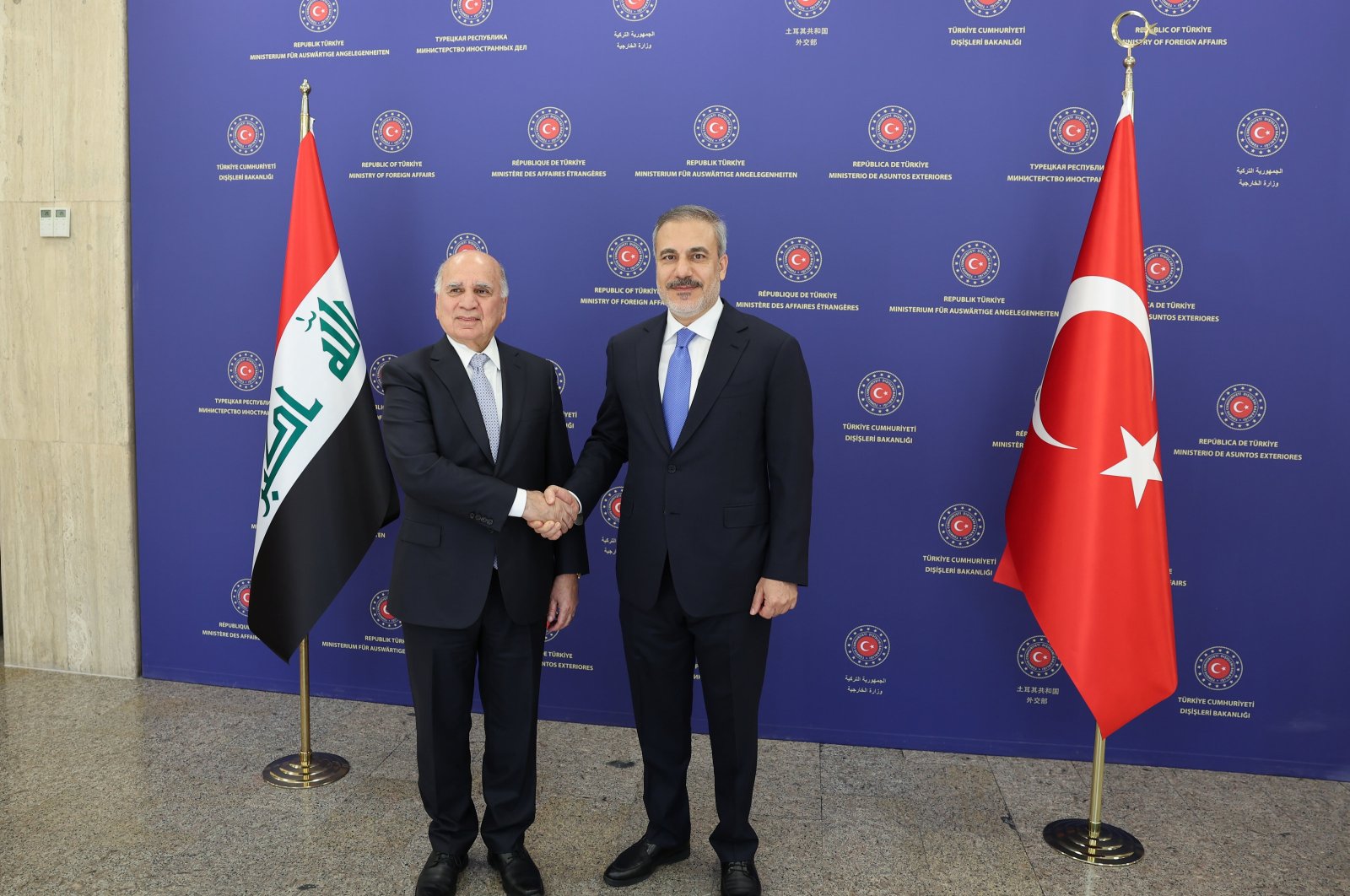 Foreign Minister Hakan Fidan (R) shakes hands with Iraqi Deputy Prime Minister and Foreign Minister Fuad Hussein ahead of a meeting, Ankara, Türkiye, Aug. 15, 2024. (AA Photo)