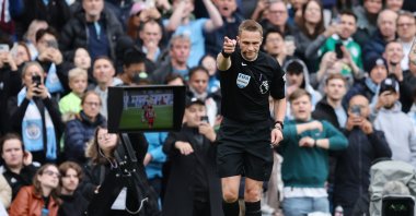 Referee Craig Pawson awards a penalty kick to Manchester City after checking for a foul on the pitchside VAR monitor during the Premier League match between Manchester City and Wolverhampton Wanderers at Etihad Stadium, Manchester, U.K., May 4, 2024. (Getty Images Photo)