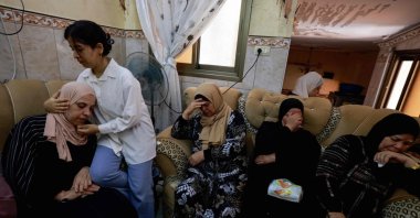 A young girl comforts the mother of a 23-year-old Palestinian man, a day after he was killed during an attack by Jewish settlers on the village of Jit near Nablus, occupied West Bank, Palestine, Aug. 16, 2024. (AFP Photo)