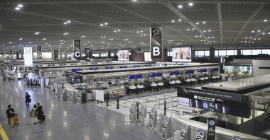 Only a few people are seen at a terminal of Narita International Airport as flights were canceled due to Typhoon Ampil, Narita, Tokyo, Aug. 16, 2024. (AP Photo)