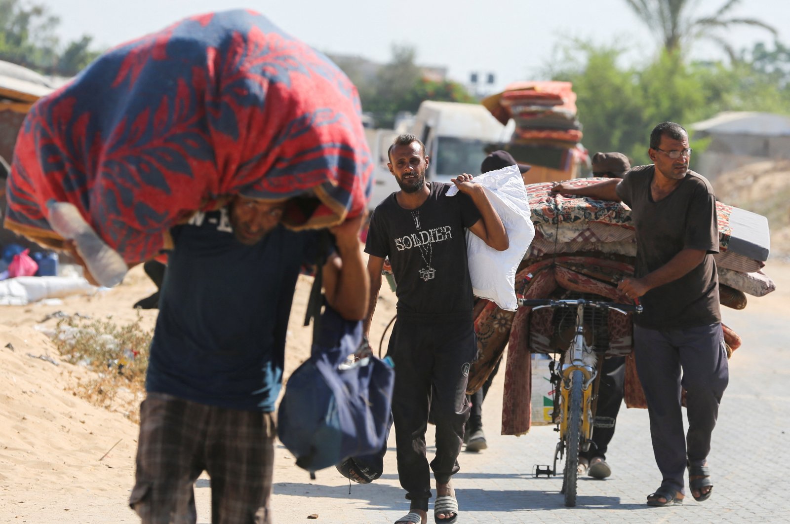 Displaced Palestinians make their way as they flee Hamad City following an Israeli evacuation order, Khan Younis, Gaza Strip, Palestine, Aug. 11, 2024. (Reuters Photo)