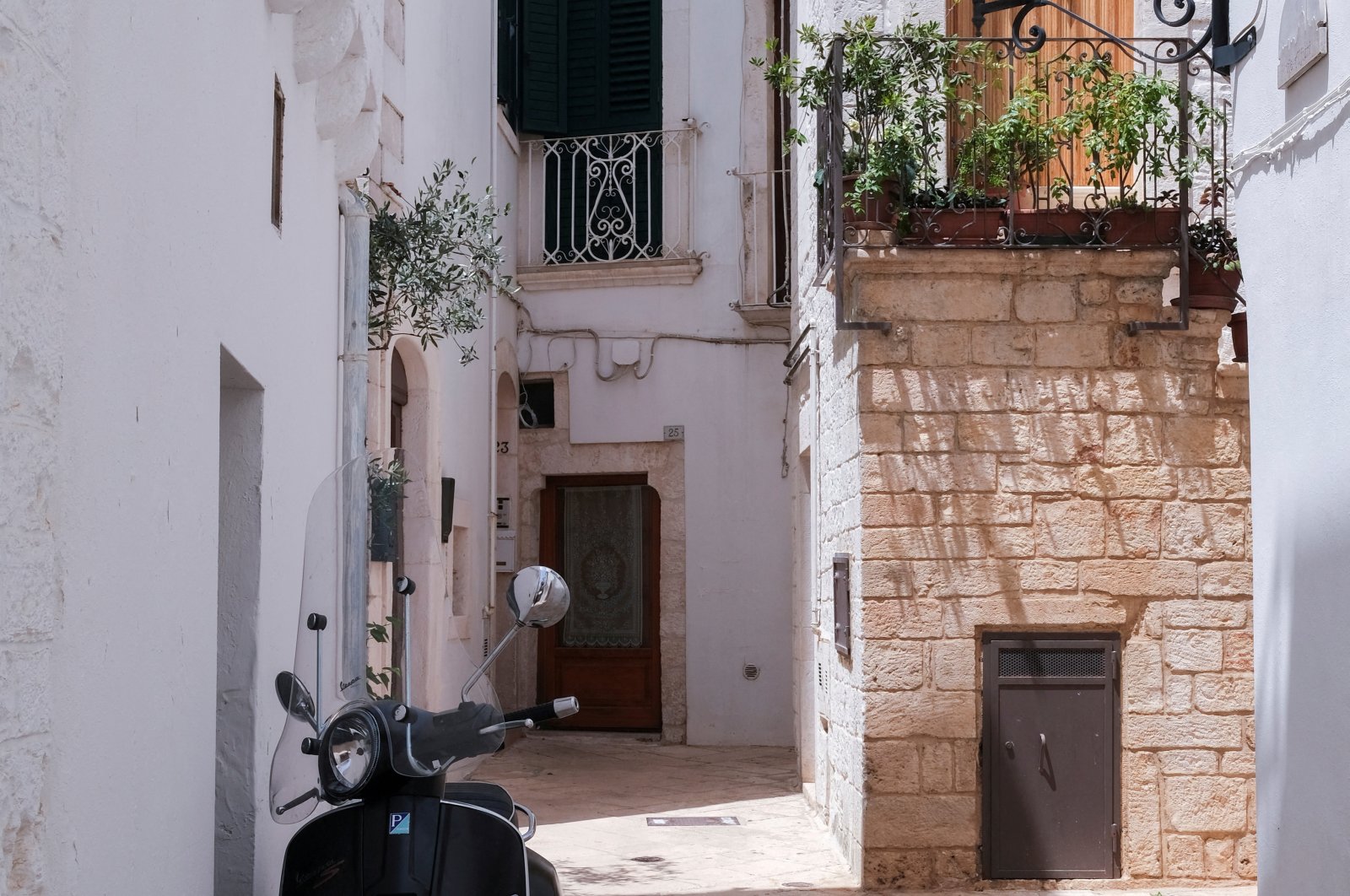 A Vespa scooter is parked in a street of Locorotondo, near Bari, in the southern region of Puglia, Italy, June 30, 2024. (Reuters Photo)