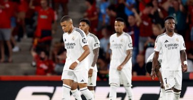 Real Madrid&#039;s Kylian Mbappe (L) and teammates react during the La Liga match between Mallorca and Real Madrid at the Mallorca Son Moix stadium, Palma, Spain, Aug. 18, 2024. (AFP Photo)