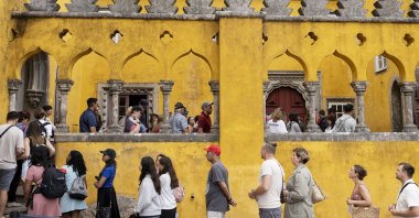 Tourists line up to visit the interior of the 19th-century Pena Palace, Sintra, Portugal, Aug. 14, 2024. (AP Photo)