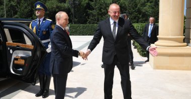 Azerbaijan's President Ilham Aliyev (R) greets Russia's President Vladimir Putin (L) in Baku, Azerbaijan, Aug. 19, 2024. (AFP Photo)