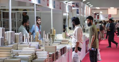 Visitors check out books at the International Istanbul Arabic Book Fair, Istanbul, Türkiye, Aug. 10, 2024. (AA Photo)