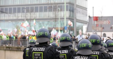 Police officers watch a rally of PKK supporters, Cologne, Germany, Feb. 17, 2024. (Getty Images)
