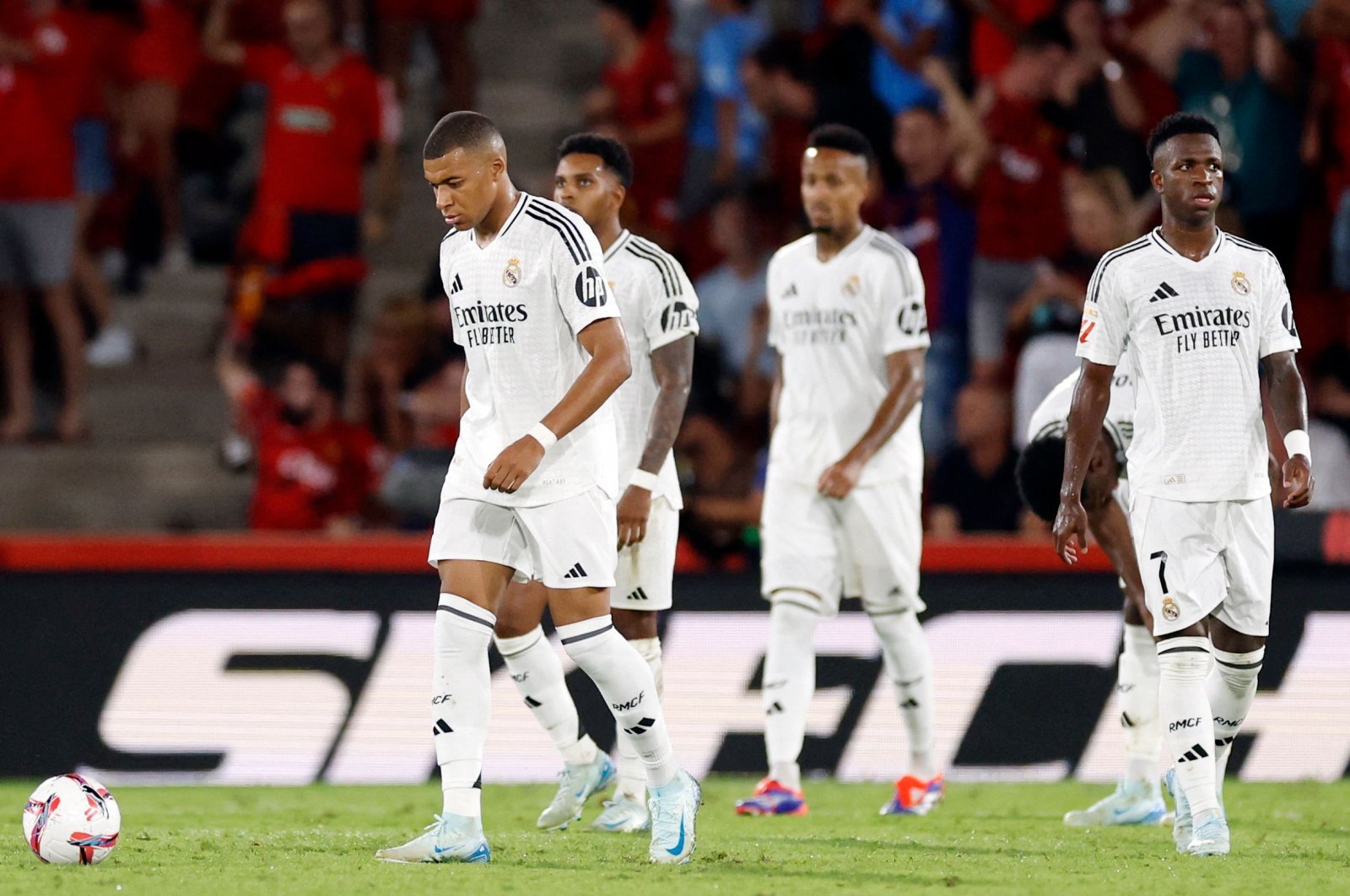 Real Madrid&#039;s Kylian Mbappe (L) and teammates react during the La Liga match between Mallorca and Real Madrid at the Mallorca Son Moix stadium, Palma, Spain, Aug. 18, 2024. (AFP Photo)