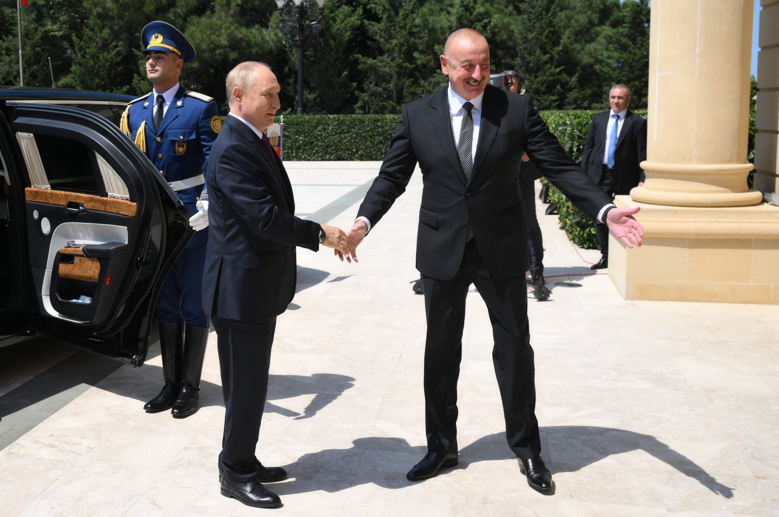 Azerbaijan&#039;s President Ilham Aliyev (R) greets Russia&#039;s President Vladimir Putin (L) in Baku, Azerbaijan, Aug. 19, 2024. (AFP Photo)