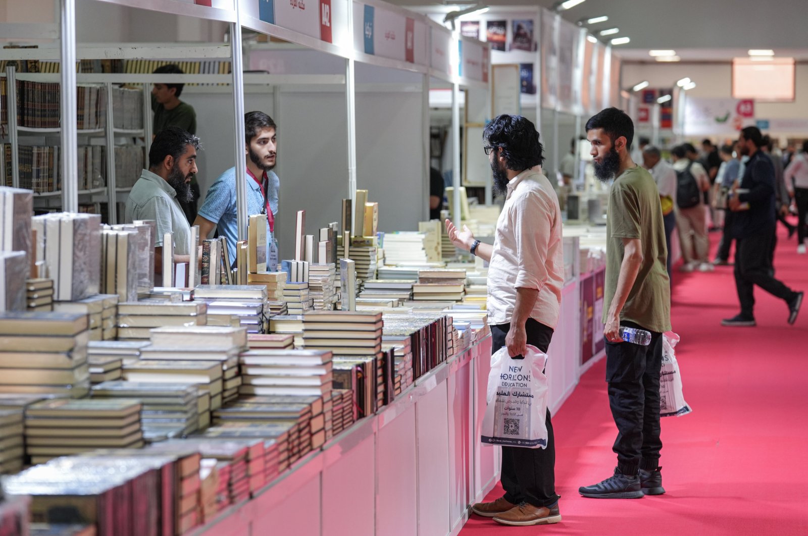 Visitors check out books at the International Istanbul Arabic Book Fair, Istanbul, Türkiye, Aug. 10, 2024. (AA Photo)