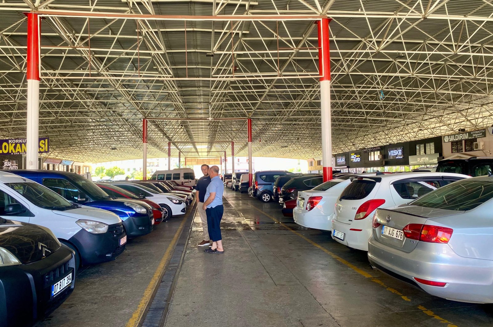 Passenger cars are photographed at a market in southern Antalya province, Türkiye, Aug. 13, 2024. (IHA Photo)