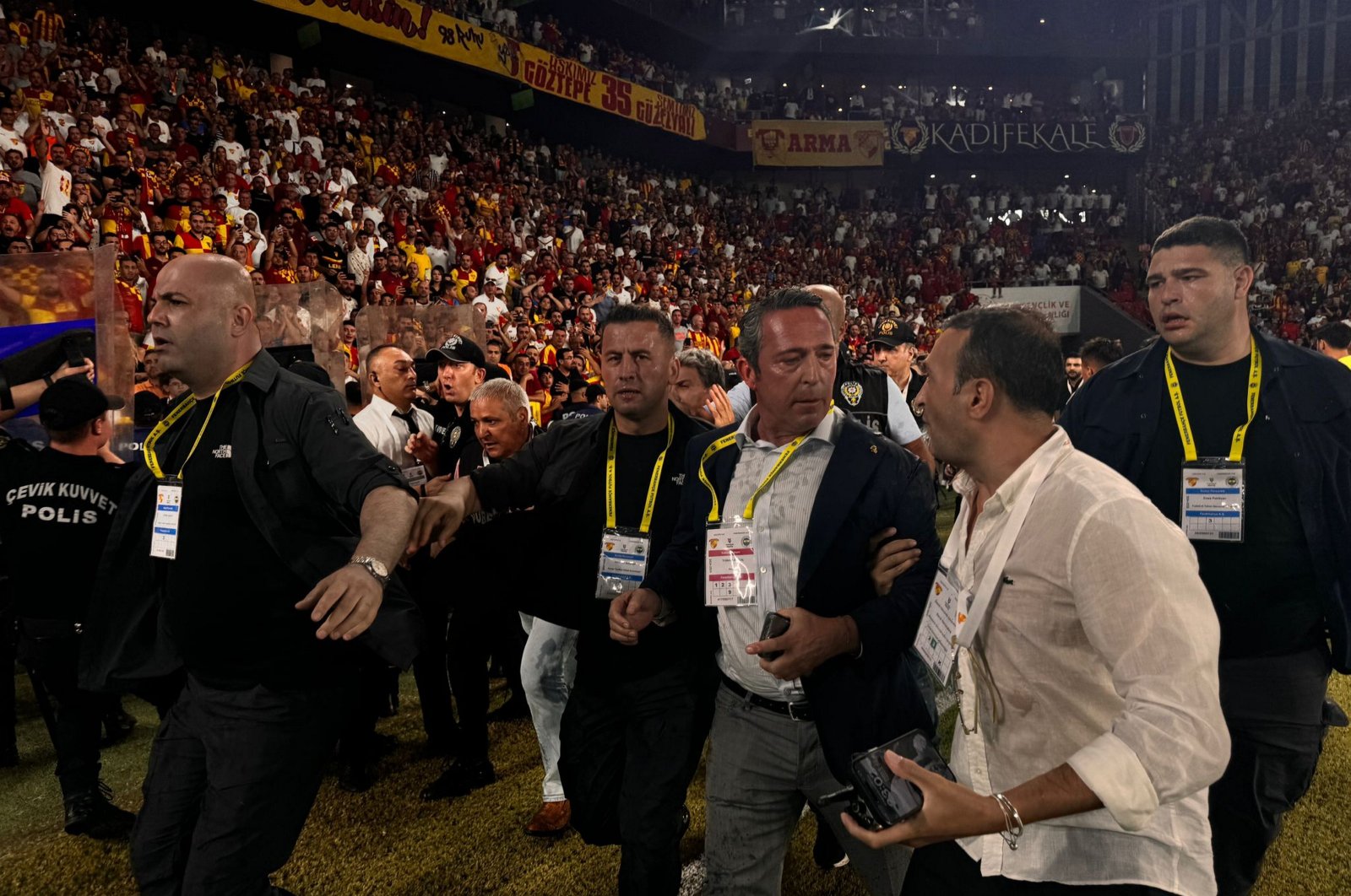 Fenerbahçe&#039;s President Ali Koç (3rd R) is escorted out of the stadium after being attacked, Izmir, Türkiye, Aug. 17, 2024. (AA Photo)