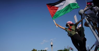 A demonstrator displays a Palestinian flag during the "March on the DNC" rally in Chicago, Illinois, U.S., Aug. 19, 2024. (Reuters Photo)