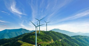 Wind turbines against a clear sky are seen in this undated stock photo. (Getty Images Photo)