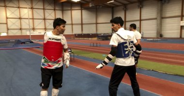 Member of the Refugee Paralympic Team Hadi Hassanzada (L) who will compete in Para taekwondo, trains ahead of the Paralympic Games, Reims, France, Aug. 19, 2024. (AP Photo)