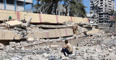 A man looks at the debris after an Israeli strike on a school housing displaced Palestinians, Rimal, central Gaza, Palestine, Aug. 20, 2024. (AFP Photo)
