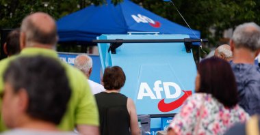 The logo of the far-right Alternative for Germany (AfD) party is seen on a grill as supporters gather for an AfD election campaign meeting in Weisswasser, Saxony, eastern Germany, Aug.14, 2024. (AFP Photo)
