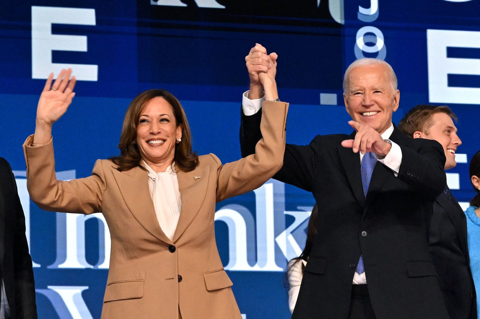 U.S. President Joe Biden holds Vice President and 2024 Democratic presidential candidate Kamala Harris hand after a keynote address on the first day of the Democratic National Convention (DNC), Chicago, Illinois, Aug. 19, 2024. (AFP Photo)