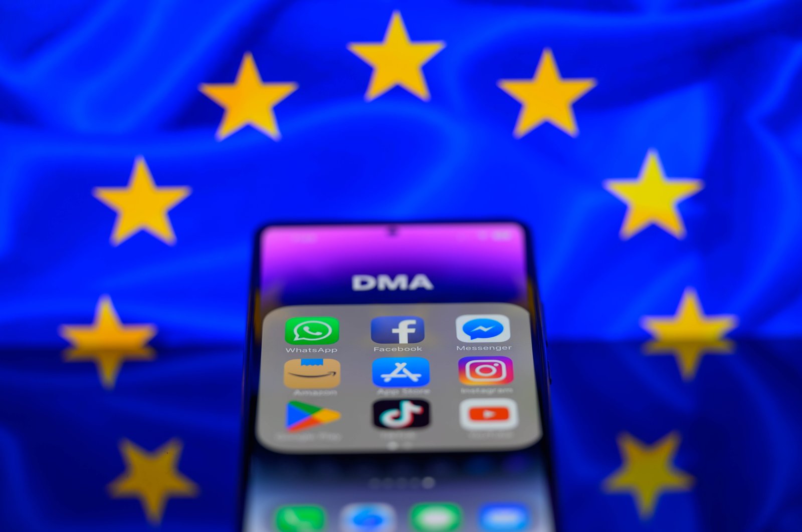 App icons of online platforms Google, Facebook, LinkedIn, Amazon, Apple Store and TikTok are displayed on a smartphone with the EU Digital Market Act (DMA) in this photo illustration, Brussels, Belgium, Feb. 17, 2024. (Reuters Photo)