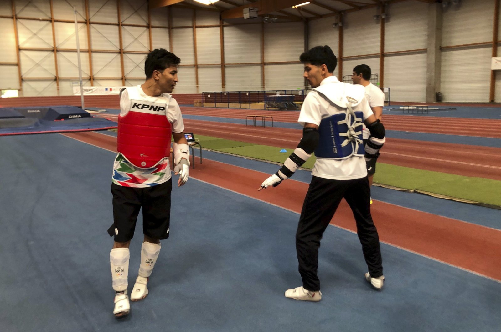 Member of the Refugee Paralympic Team Hadi Hassanzada (L) who will compete in Para taekwondo, trains ahead of the Paralympic Games, Reims, France, Aug. 19, 2024. (AP Photo)