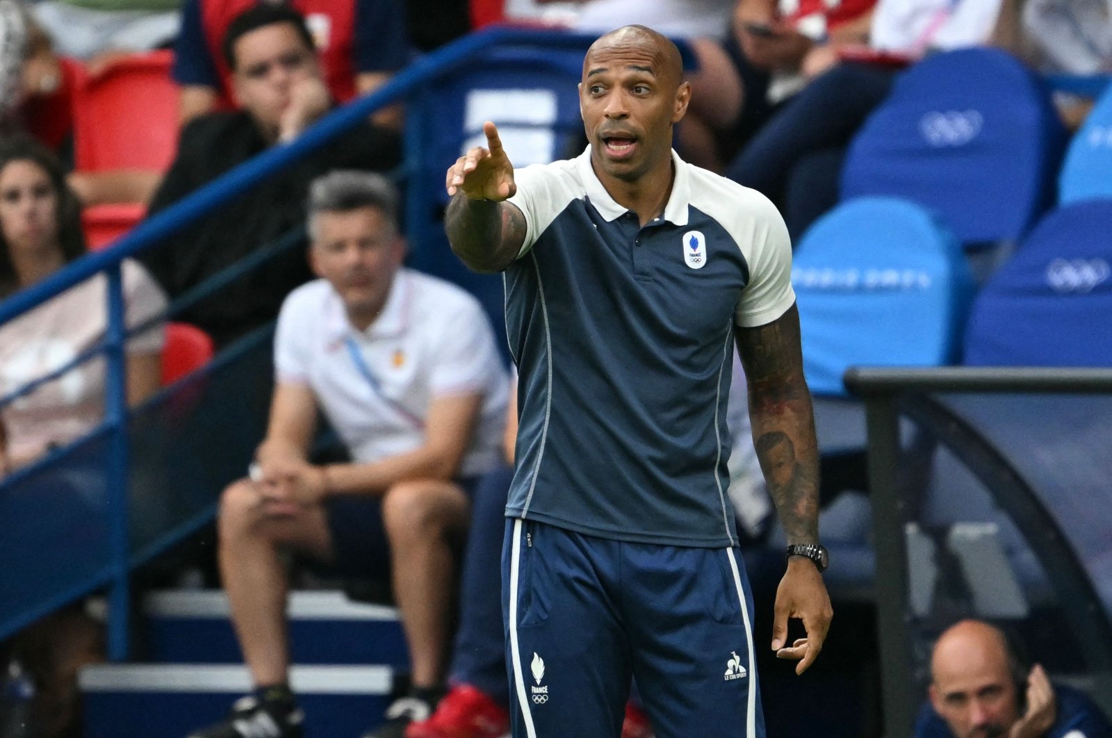 France&#039;s coach Thierry Henry gives instructions to players in the men&#039;s gold medal final football match between France and Spain during the Paris 2024 Olympic Games at the Parc des Princes, Paris, France, Aug. 9, 2024. (AFP Photo)