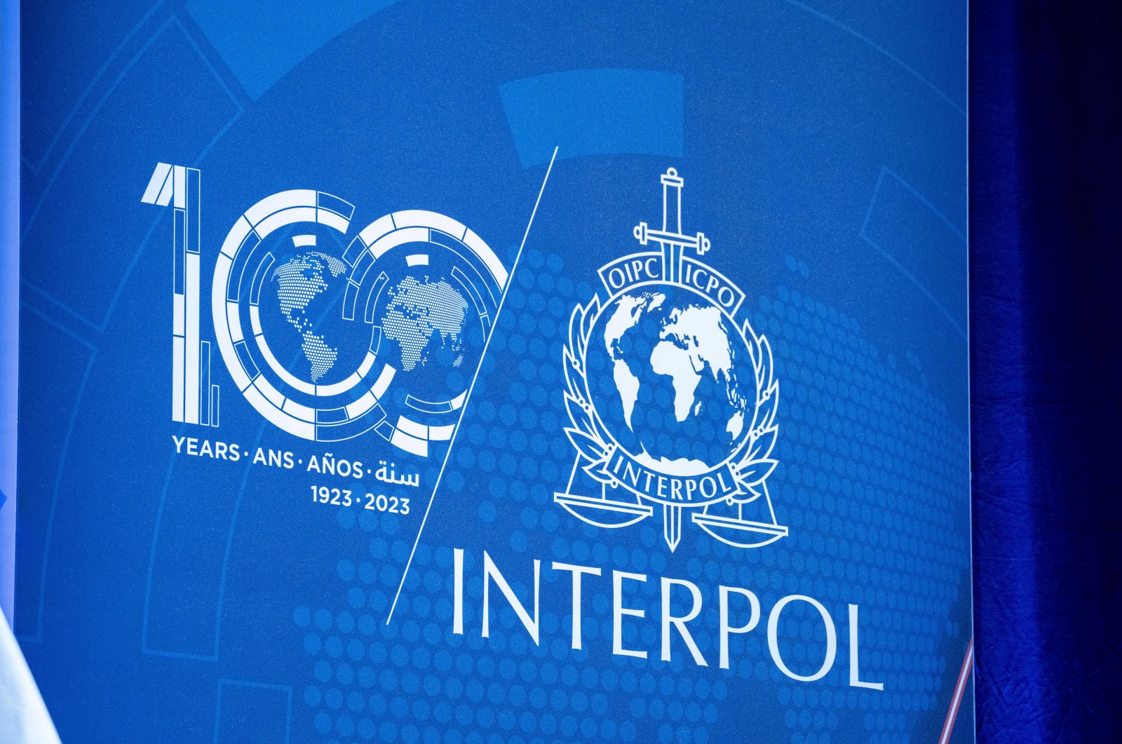 Interpol&#039;s logo is seen at the Closing Ceremony of the 91st INTERPOL General Assembly in Vienna, Dec. 3, 2023. (Reuters File Photo)