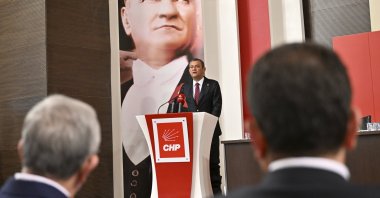 Istanbul Mayor Ekrem Imamoğlu (R) and Ankara Mayor Mansur Yavaş (L) look on as Republican People's Party (CHP) Chair Özgür Özel (C) speaks at party headquarters, Ankara, Türkiye, Aug. 20, 2024. (AA Photo)
