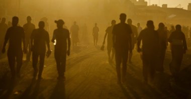 Palestinians walk in an area damaged during the Israeli offensive, in Khan Younis, southern Gaza Strip, Palestine, Aug. 20, 2024. (Reuters Photo)