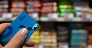 A bank card with the Troy logo is seen in a market at an undisclosed location, Türkiye, Nov. 9, 2023. (AA Photo)