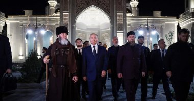 Russia&#039;s President Vladimir Putin (C) walks next to the head of the Chechen Republic Ramzan Kadyrov (C-R) and Mufti of Chechnya Sheikh Salah-Hadzhi Mezhiev (L) during his visit to Chechnya in Grozny on Aug. 20, 2024. (Sputnik, Handout via AFP)