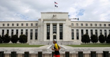 A jogger runs past the Federal Reserve building in Washington, D.C., U.S., Aug. 22, 2018. (Reuters File Photo)